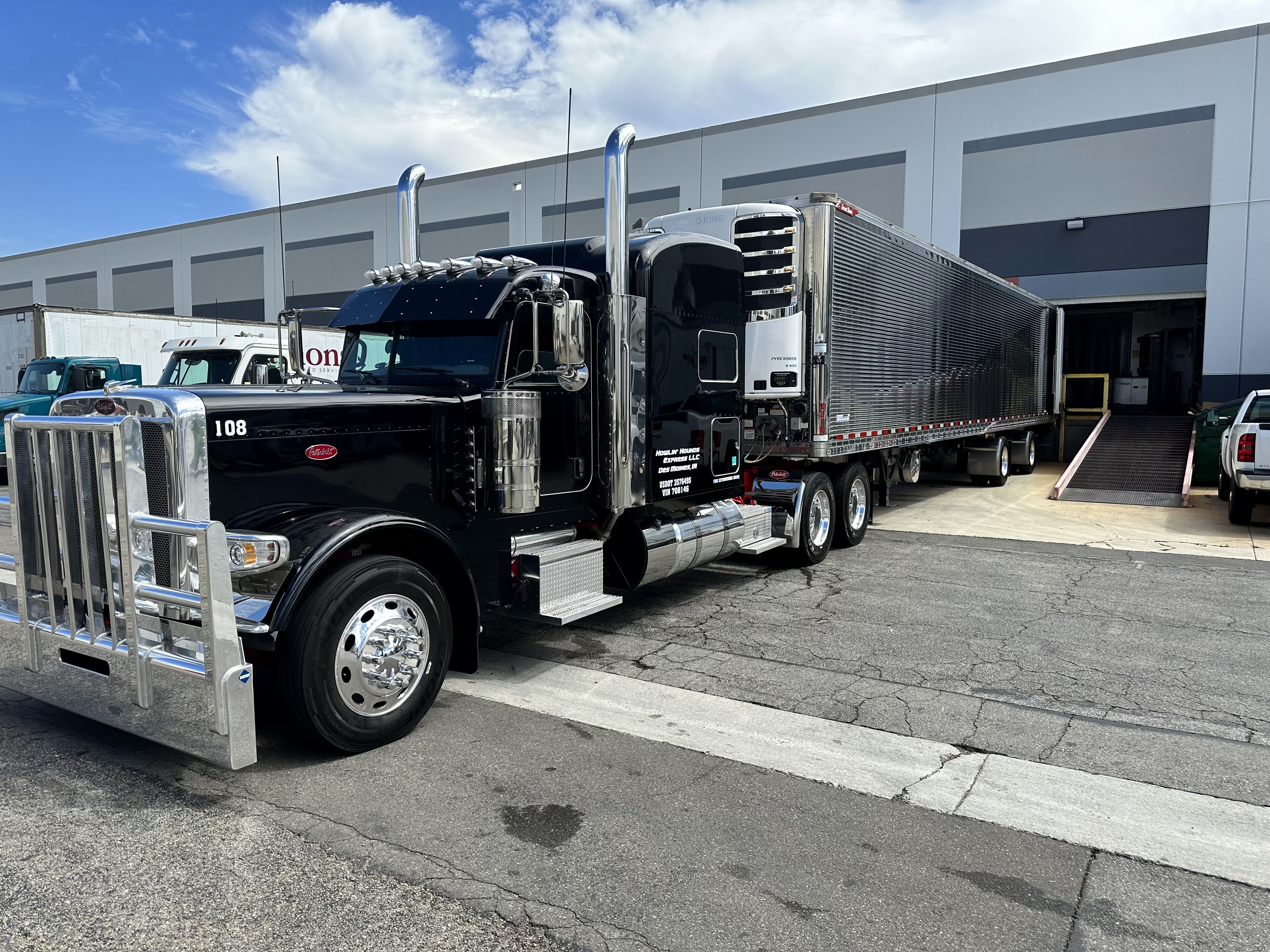 Black Howlin Hounds Express Peterbilt truck number 108