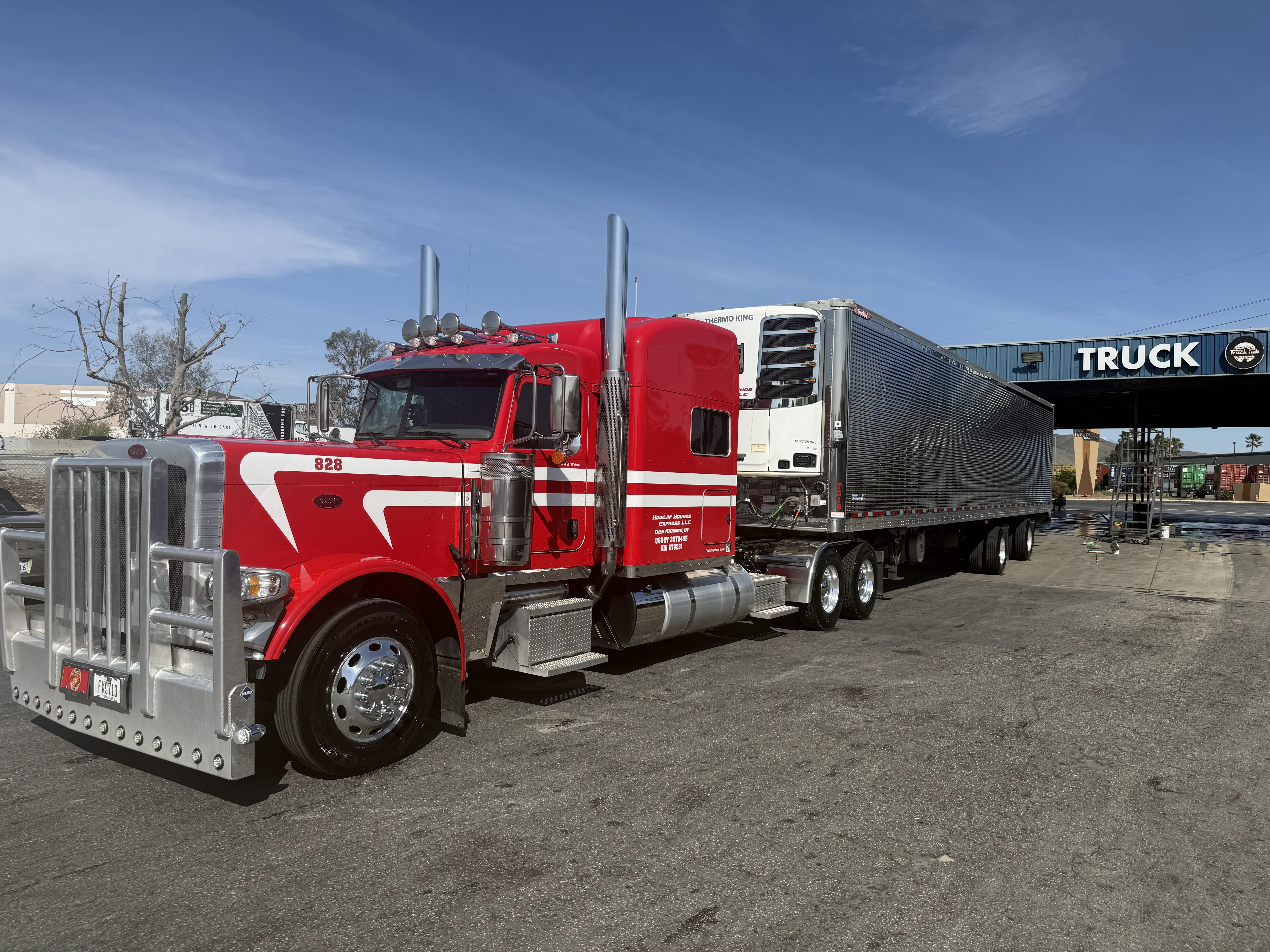 Red Howlin Hounds Express Peterbilt truck number 828